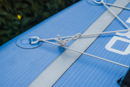 inflatable paddle Board close-up, elastic slings for Luggage