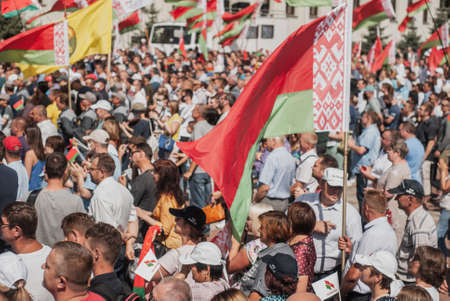 MINSK, BELARUS, AUGUST 16, 2020 rally in support of Belarusian President Alexander Lukashenko, the Belarusian flag on the background of the crowdのeditorial素材