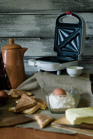 make sandwiches, dough ingredients and kitchen utensils on a wooden table,