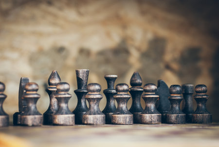 chess casts a shadow on the wall, black pieces made of woodの写真素材