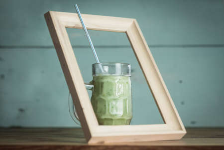glass of vegetable smoothies in a wooden frame, healthy foodの写真素材