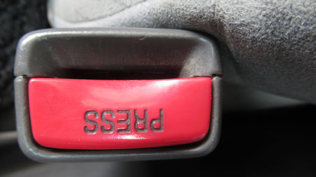 Red press seat belt button