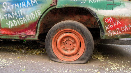 Baku, Azerbaijan, July 5 2020 : Old, rusty colored russian-soviet car abandoned on the street