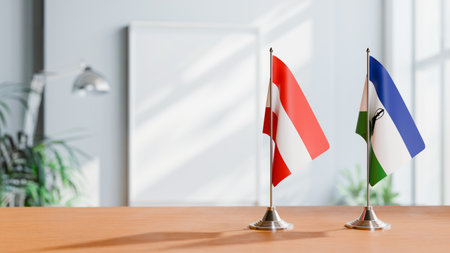 FLAGS OF  AUSTRIA AND LESOTHO  ON TABLEの写真素材