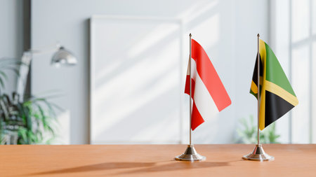 FLAGS OF  AUSTRIA AND JAMAICA  ON TABLEの写真素材