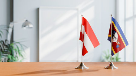 FLAGS OF  AUSTRIA AND SWAZILAND  ON TABLEの写真素材