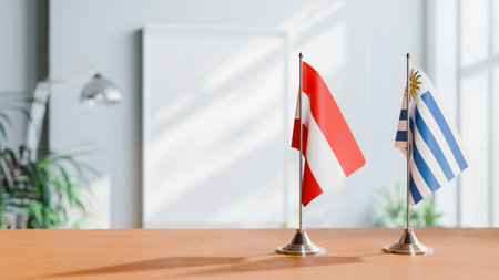 FLAGS OF  AUSTRIA AND URUGUAY  ON TABLEの写真素材