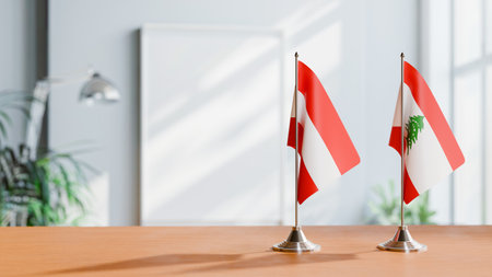 FLAGS OF  AUSTRIA AND LEBANON  ON TABLEの写真素材