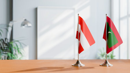 FLAGS OF  AUSTRIA AND MALDIVES  ON TABLEの写真素材