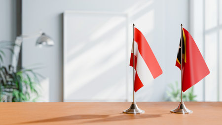 FLAGS OF  AUSTRIA AND EAST TIMOR  ON TABLEの写真素材