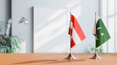 FLAGS OF  AUSTRIA AND PAKISTAN  ON TABLEの写真素材