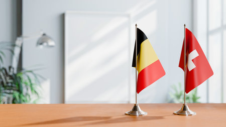 FLAGS OF  BELGIUM AND SWITZERLAND  ON TABLEの写真素材