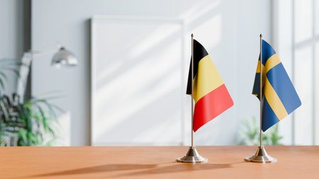 FLAGS OF  BELGIUM AND SWEDEN  ON TABLEの写真素材
