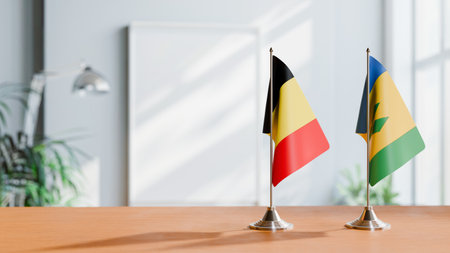 FLAGS OF  BELGIUM AND SAINT VINCENT  ON TABLEの写真素材