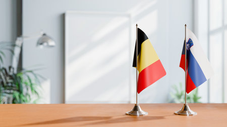 FLAGS OF  BELGIUM AND SLOVENIA  ON TABLEの写真素材