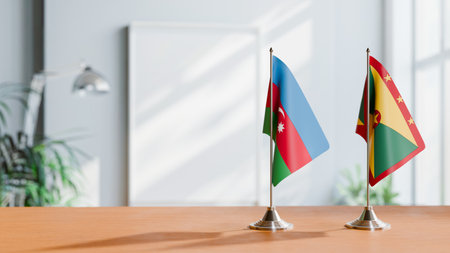 FLAGS OF  AZERBAIJAN AND GRENADA  ON TABLEの写真素材