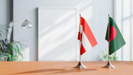 FLAGS OF  AUSTRIA AND BANGLADESH  ON TABLEの写真素材