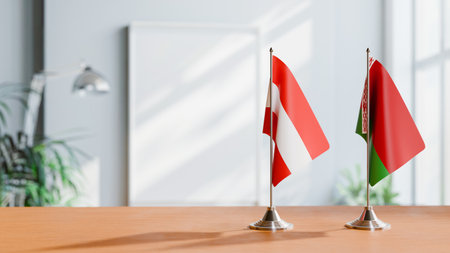 FLAGS OF  AUSTRIA AND BELARUS  ON TABLEの写真素材