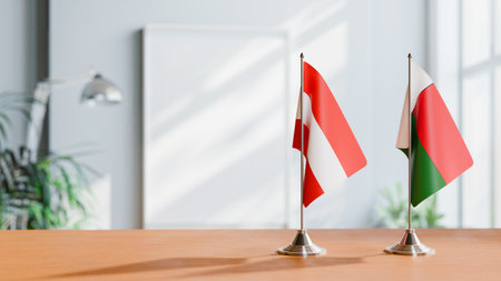 FLAGS OF  AUSTRIA AND MADAGASCAR  ON TABLEの写真素材