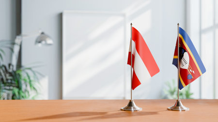 FLAGS OF  AUSTRIA AND ESWATINI  ON TABLEの写真素材