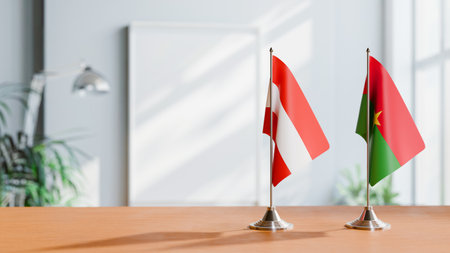 FLAGS OF  AUSTRIA AND BURKINA-FASO  ON TABLEの写真素材