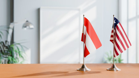 FLAGS OF  AUSTRIA AND LIBERIA  ON TABLEの写真素材
