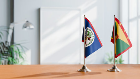 FLAGS OF BELIZE AND GRENADA ON TABLEの写真素材