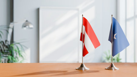 FLAGS OF  AUSTRIA AND SOMALIA  ON TABLEの写真素材