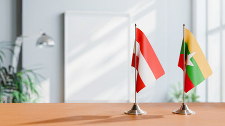 FLAGS OF  AUSTRIA AND MYANMAR  ON TABLEの写真素材