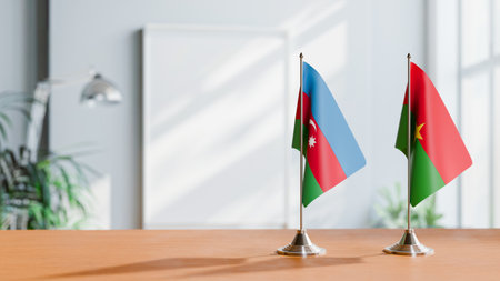 FLAGS OF  AZERBAIJAN AND BURKINA-FASO  ON TABLEの写真素材