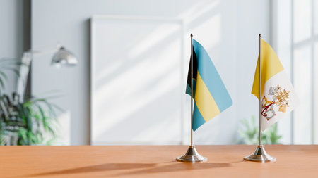FLAGS OF BAHAMAS AND VATICAN ON TABLEの写真素材