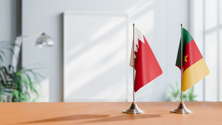 FLAGS OF  BAHRAIN AND CAMEROON  ON TABLEの写真素材