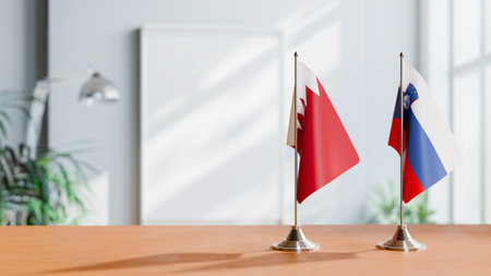 FLAGS OF  BAHRAIN AND SLOVENIA  ON TABLEの写真素材