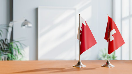 FLAGS OF  BAHRAIN AND SWITZERLAND  ON TABLEの写真素材