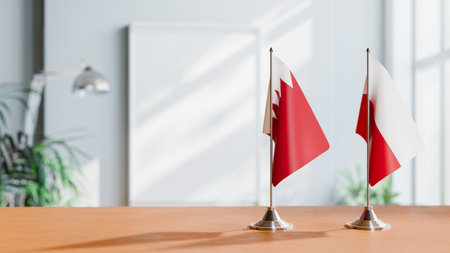 FLAGS OF  BAHRAIN AND POLAND  ON TABLEの写真素材