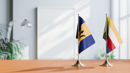 FLAGS OF  BARBADOS AND COMOROS  ON TABLEの写真素材