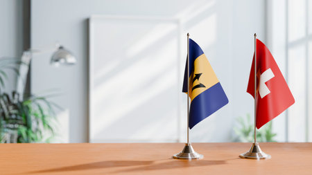 FLAGS OF  BARBADOS AND SWITZERLAND  ON TABLEの写真素材