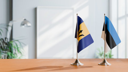 FLAGS OF  BARBADOS AND ESTONIA  ON TABLEの写真素材