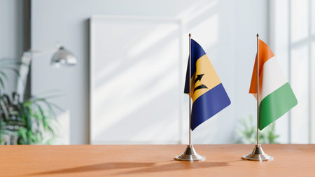 FLAGS OF  BARBADOS AND IVORY COAST  ON TABLEの写真素材