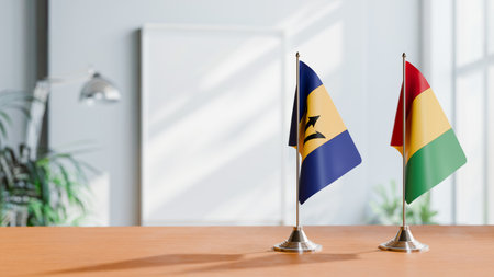 FLAGS OF  BARBADOS AND GUINEA  ON TABLEの写真素材