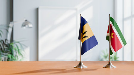 FLAGS OF  BARBADOS AND SURINAME  ON TABLEの写真素材