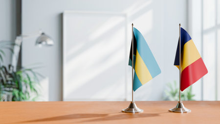 FLAGS OF BAHAMAS AND ROMANIA ON TABLEの写真素材