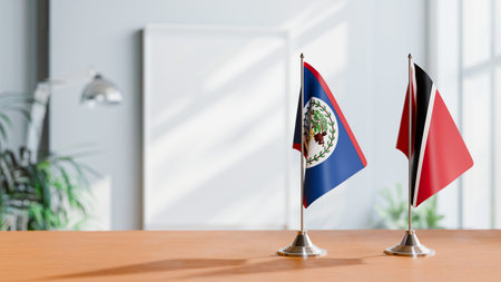 FLAGS OF BELIZE AND TRINIDAD ON TABLEの写真素材