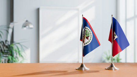 FLAGS OF BELIZE AND HAITI ON TABLE