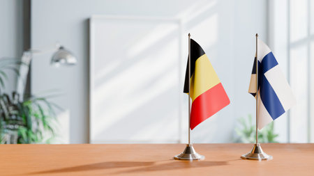 FLAGS OF  BELGIUM AND FINLAND  ON TABLE
