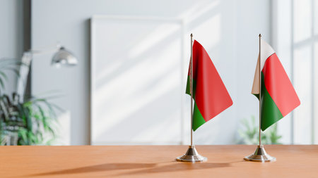 FLAGS OF  BELARUS AND MADAGASCAR  ON TABLEの写真素材