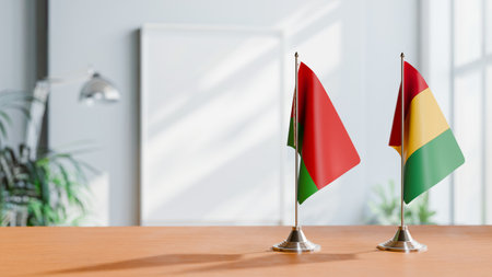 FLAGS OF  BELARUS AND GUINEA  ON TABLEの写真素材