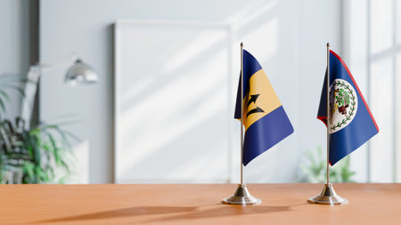 FLAGS OF  BARBADOS AND BELIZE  ON TABLE