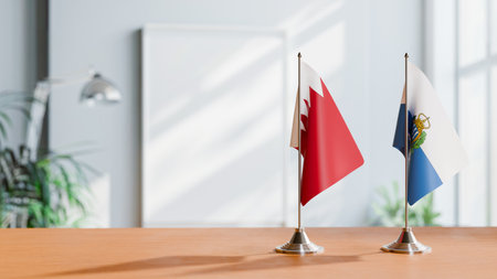 FLAGS OF  BAHRAIN AND SAN MARINO  ON TABLEの写真素材
