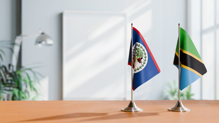 FLAGS OF BELIZE AND TANZANIA ON TABLEの写真素材